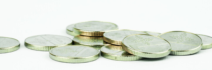 silver coins pile scattered on table extreme closeup