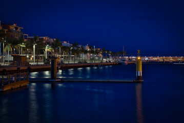 Fototapeta na wymiar Maritime promenade at night. Gandia.