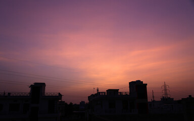 Sky over buildings wears different colors during sunset in Beawar, Rajasthan, India. The monsoon arrived in Rajasthan with rains lashing some parts of the state. Phot: Sumit Saraswat