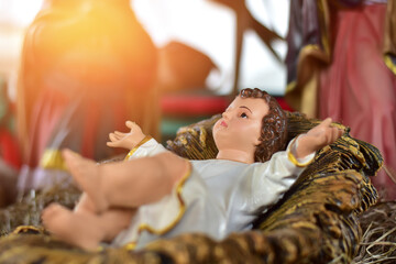 Statuettes of Mary, Joseph and baby Jesus,The birthday of Jesus is a statuette of Maria with Joseph and newborn Jesus on the hay, A Christmas nativity scene.