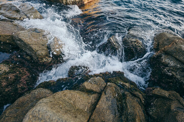 A large waterfall over a rocky cliff