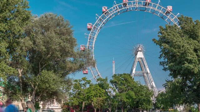 Wiener Riesenrad in Prater timelapse - oldest and biggest ferris wheel in Austria. Symbol of Vienna city. View from park