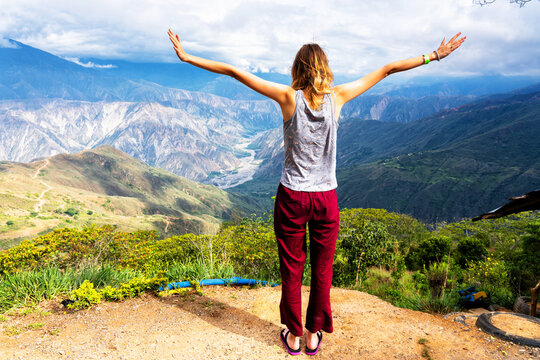 Woman admiring views of Chicamocha canyon in Colombia in the Andes mountain range. South America