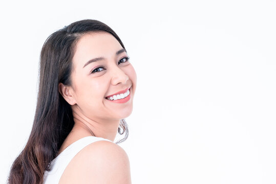 Portrait images of Asian young, pretty woman is 25 years old, She is smiling brightly, She has beautiful white and clean teeth, sparking eyes On white background to people and beauty concept.