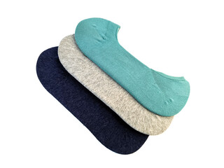Three pairs of new socks in gray, navy blue and turquoise isolated on a white background. Set of socks are stacked on top of each other.