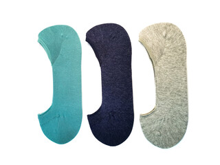 Three pairs of new socks in gray, navy blue and turquoise isolated on a white background. Set of socks lie in a row.