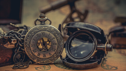 Fototapeta na wymiar Antique Pocket Watch And Magnifying Glass