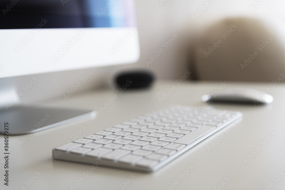 Poster work desk with a computer on a blurred background