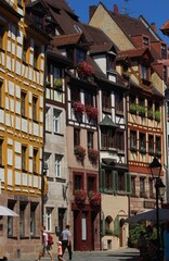Fototapeta premium Old town street with traditional half-timbered houses in Nuremberg Germany