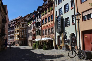 Fototapeta na wymiar Beautiful street of half timbered houses and the bicycle in the Old Town of Nuremberg