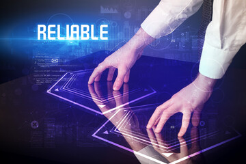 Hand touching digital table with RELIABLE inscription, new age security concept