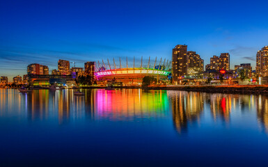 Vancouver skyline on False Creek and BC Place stadium at night in British Columbia Canada
