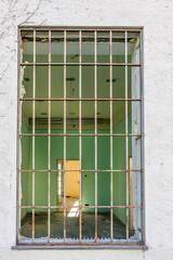 old prison window with bars