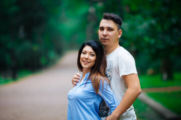 Fototapeta premium couple posing on the streets of a European city in summer weather.