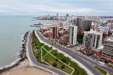 Aerial view from drone of panoramic cityscape of Mar del Plata city. Paseo Davila road along...