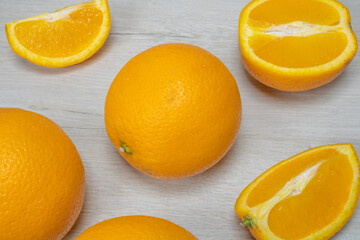Photo with oranges on bleached wood. Background on the theme of fruit.