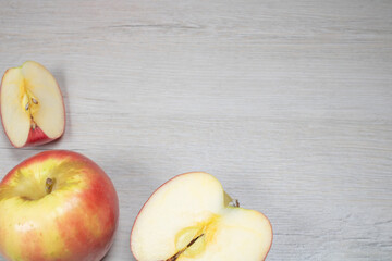 Background on the theme of fruits, apples. Apples on a background of bleached wood.