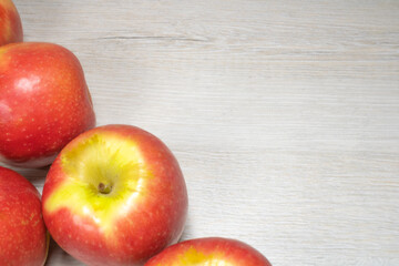 Background on the theme of fruits, apples. Apples on a background of bleached wood.