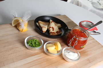 Blinis with red caviar