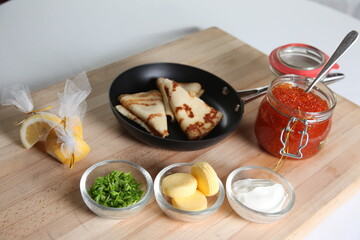 Blinis with red caviar