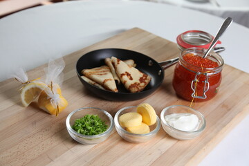 Blinis with red caviar