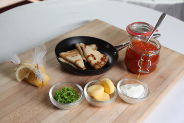 Blinis with red caviar