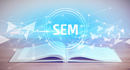 Open book with SEM abbreviation, modern technology concept