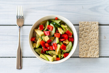 Top view f a bowl with vegetables salad