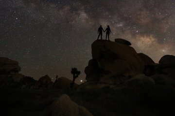 Loving Couple Silhouette Under the Stars at Night