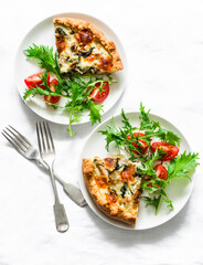Canned tuna, mozzarella cheese, spinach, potatoes and mizuna tomatoes salad on light background, top view. Delicious tapas, breakfast, brunch