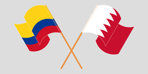 Crossed and waving flags of Colombia and Bahrain