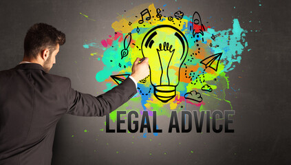 businessman drawing colorful light bulb with LEGAL ADVICE inscription on textured concrete wall, new business idea concept