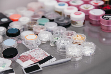 foil and rhinestones in boxes for manicure