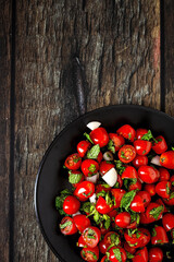 Homemade cherry tomato salad with fresh onions, mint, olive oil and salt