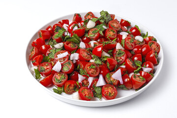 Homemade cherry tomato salad with fresh onions, mint, olive oil and salt