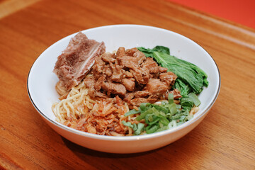 Chicken noodles with beef rib. pieces of mustard leaf