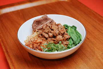 Chicken noodles with beef rib. pieces of mustard leaf