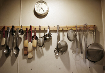 Professional kitchen, tools hanging on the wall