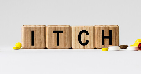 cubes with the word itch on them. Care concept.