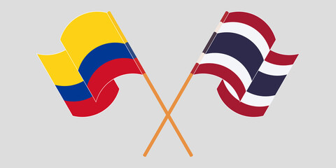 Crossed and waving flags of Colombia and Thailand