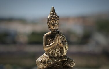statue of buddha meditating in Thailand.