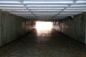 underground pedestrian tunnel, daylight at the end of the tunnel