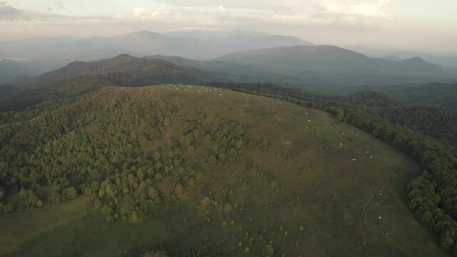 Aerial parallax of camping tents on top Max Patch Mountain in Appalachians