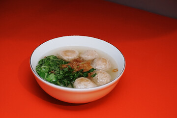 beef meatball soup with vermicelli and fried onions and fresh mustard leaves