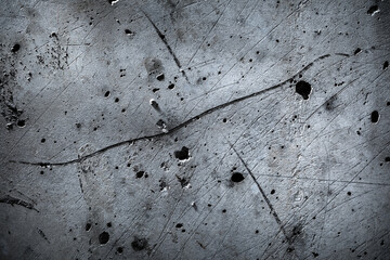 Detailed close up of  surface patterns, textures and marks on a concrete wall. Black and white...