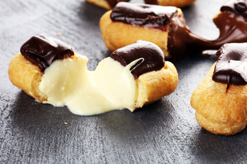 Traditional French dessert. Eclair with chocolate icing. Pastery dessert concept