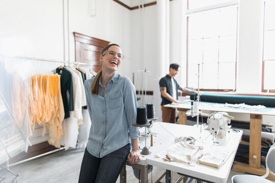 Portrait Of Woman Laughing In Fabric Design Studio