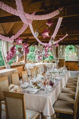 Decorated table and terrace in the cafe ready for girl's birthday party