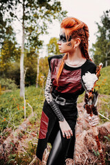 Girl in ethnic scandinavian costume in the forest