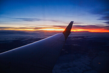 Obraz premium Sunrise from an Airplane Window